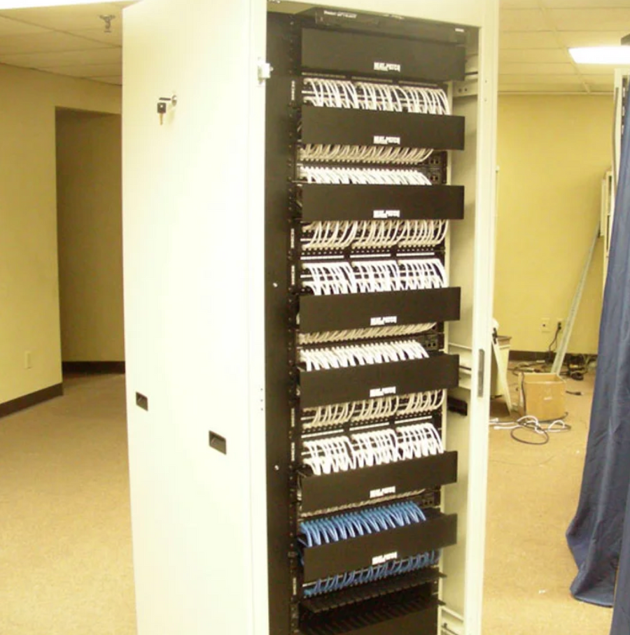 Full-height network cabinet featuring NEAT-PATCH cable management for organized structured cabling installation
