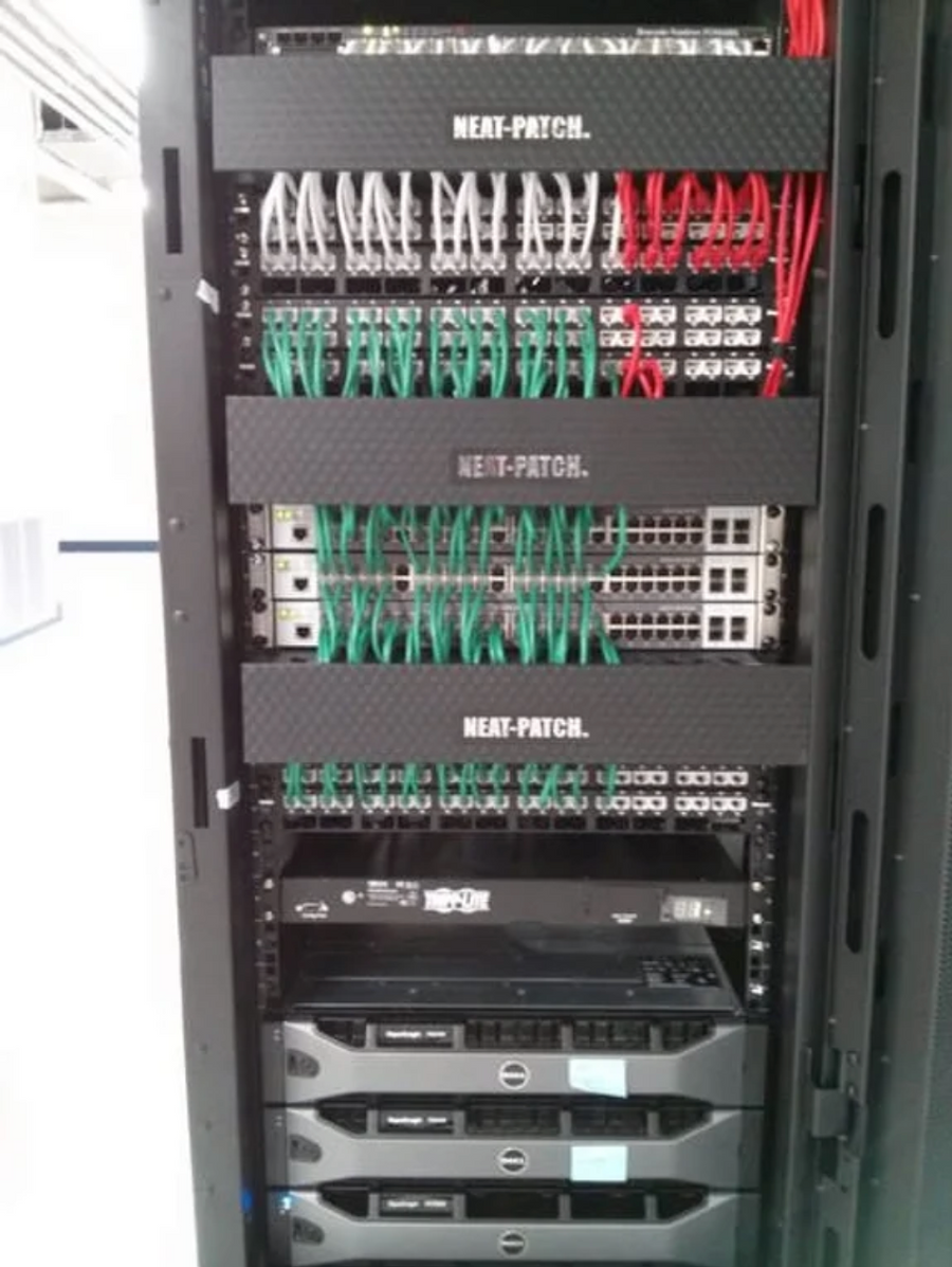 Customer photo showing organized network cable management using NEAT-PATCH cable managers