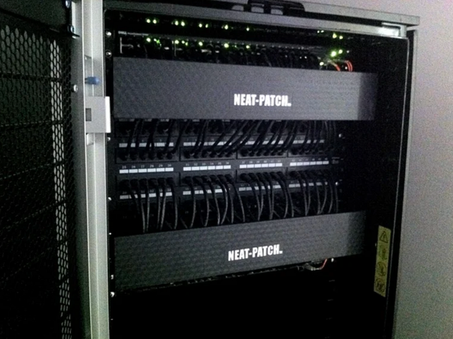 NEAT-PATCH network cable management system organizing black patch cords in structured data rack
