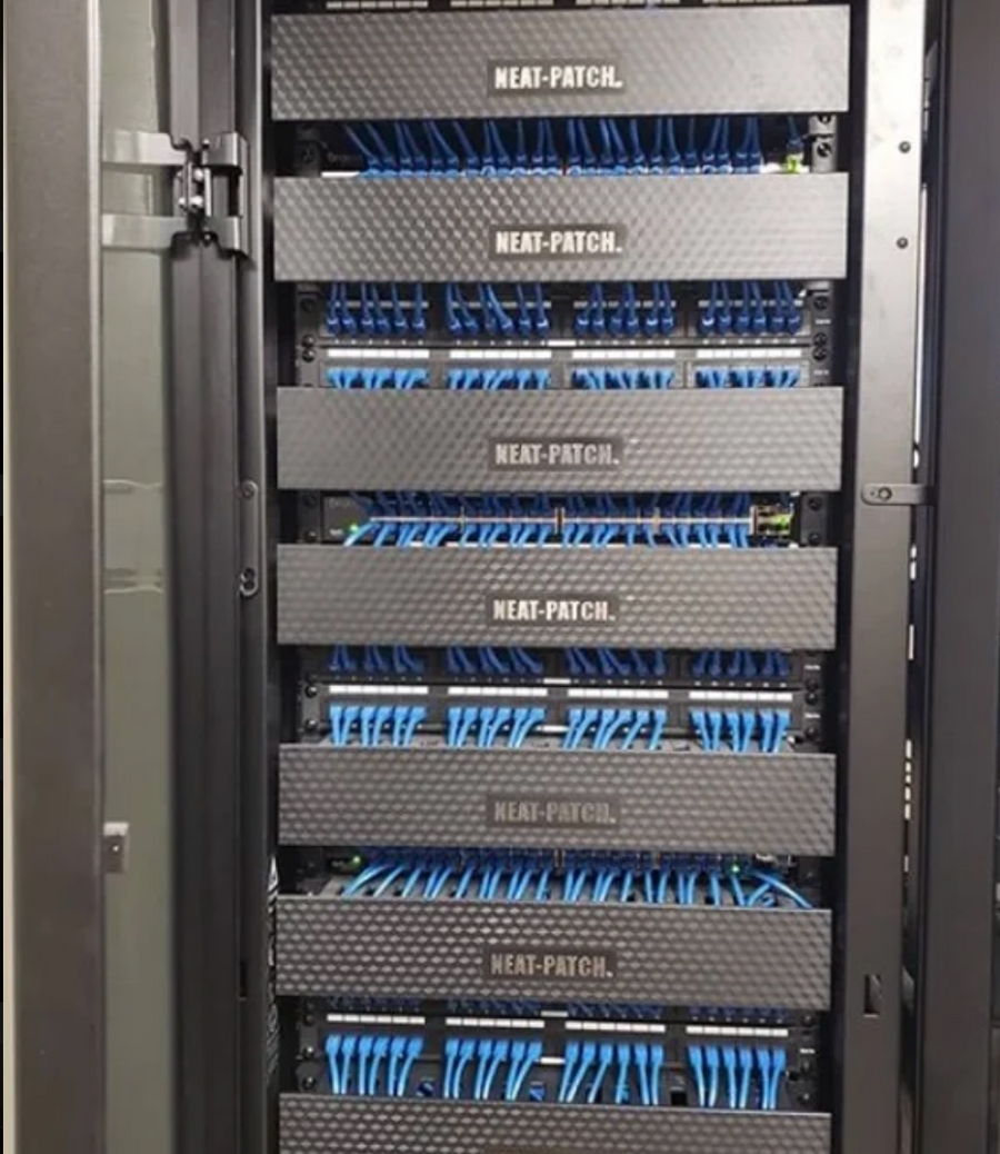 Customer network rack installation featuring NEAT-PATCH cable management with uniform patch cable routing