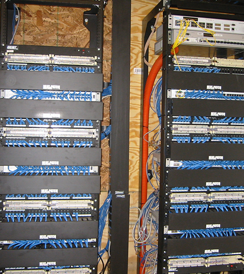 Organized network rack with structured network cable management using NEAT-PATCH 2U cable managers